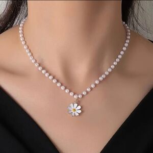 Elegant Pearl Necklace with Daisy Pendant